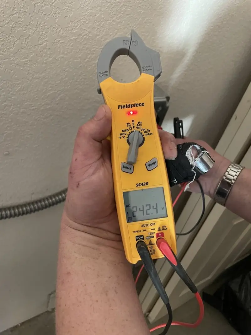 Voltage testing with clamp meter during Aluminum Wiring Replacement in Austin